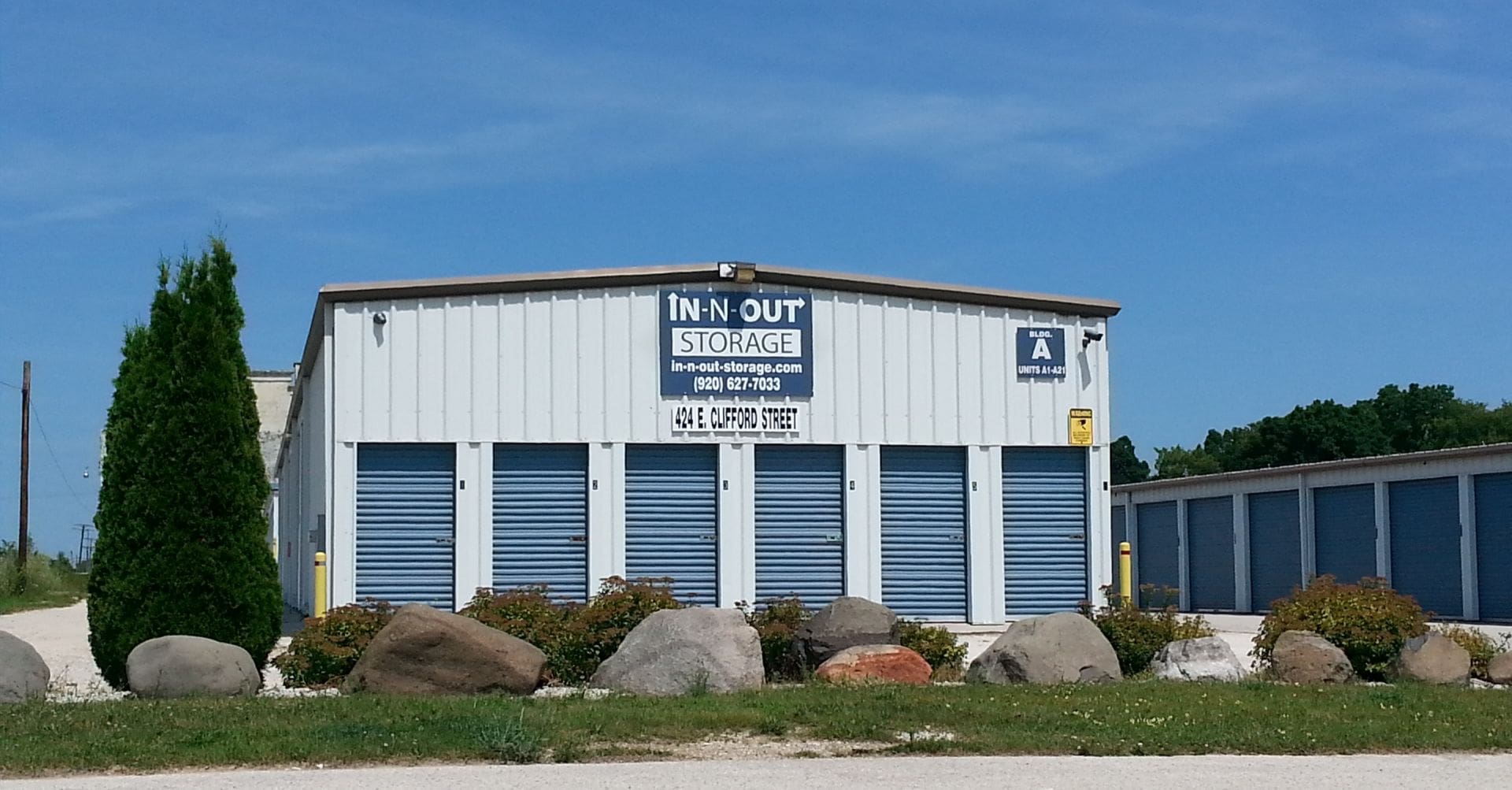 white building with blue doors; Self Storage building - Clifford North